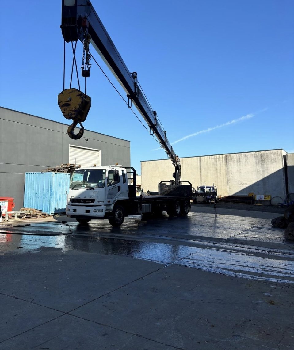 Crane truck with long boom raised