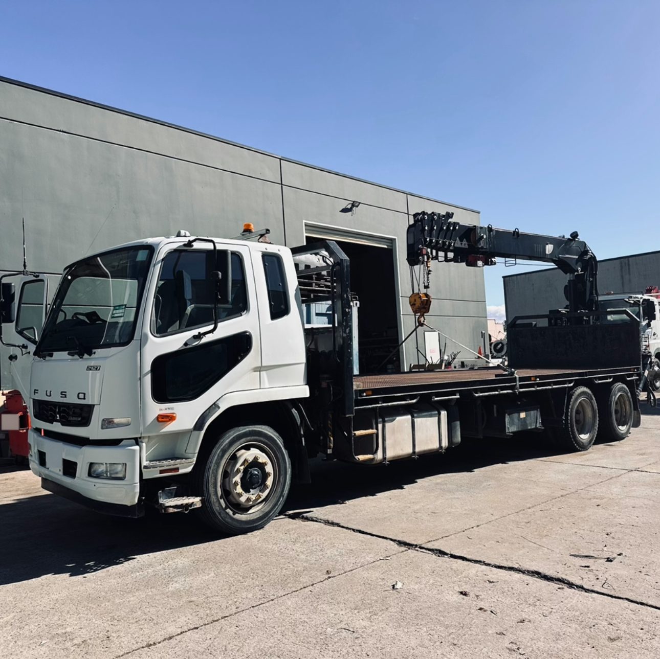 Long-tray crane truck in the yard