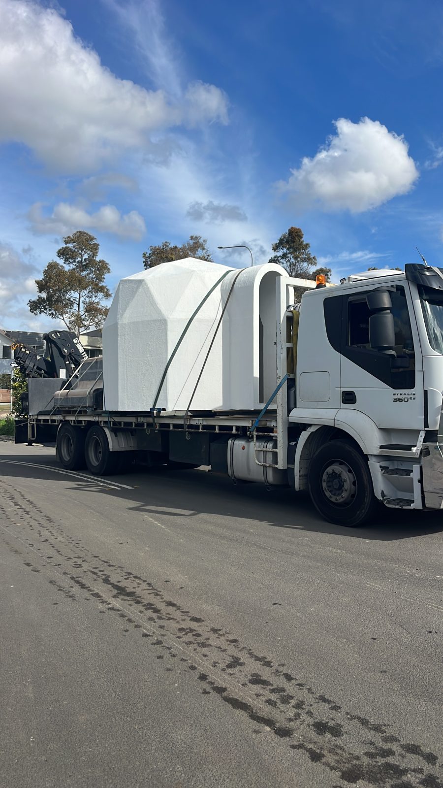Iveco crane truck delivering a large oversize module