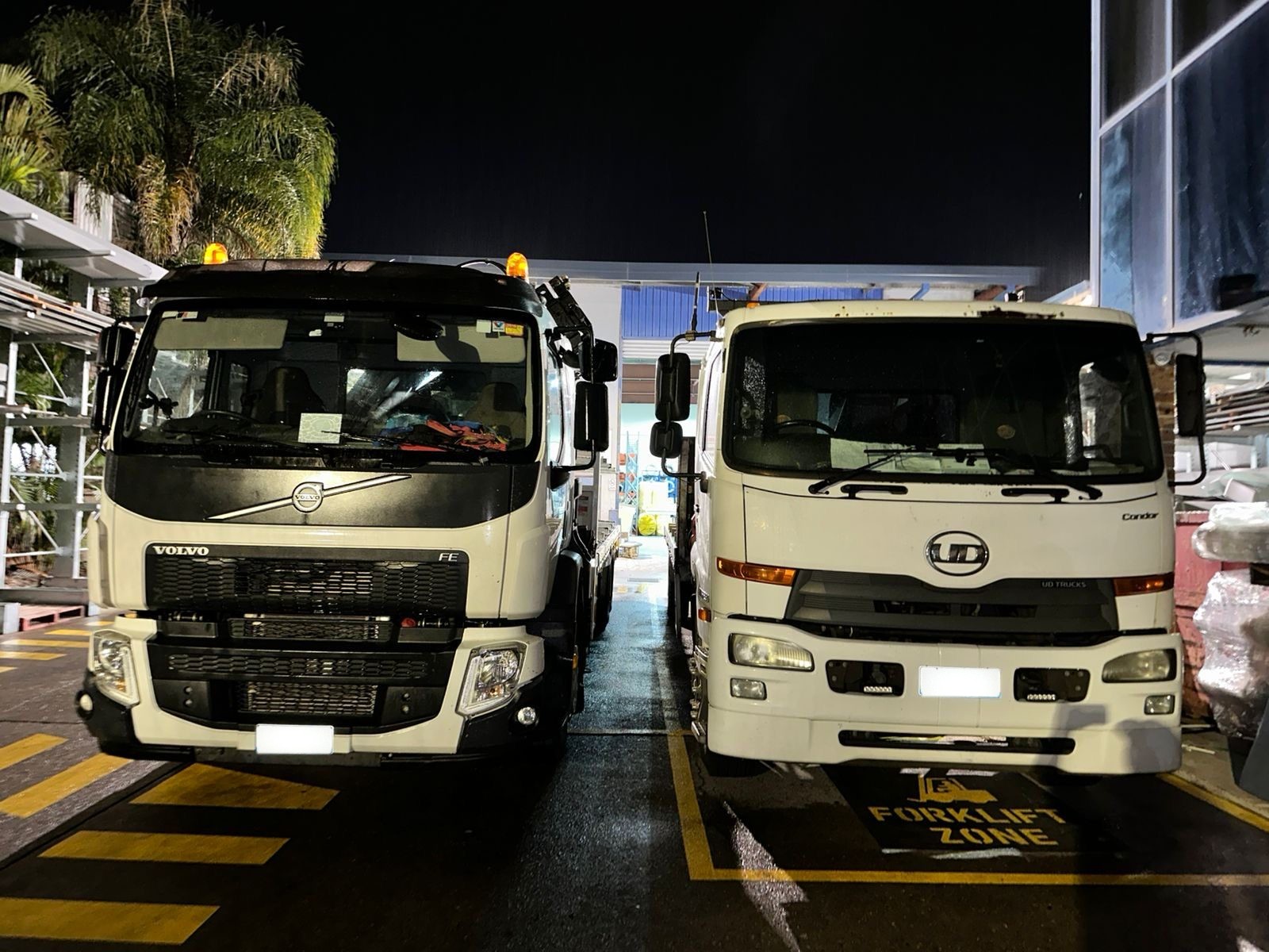 Crane trucks parked at the depot